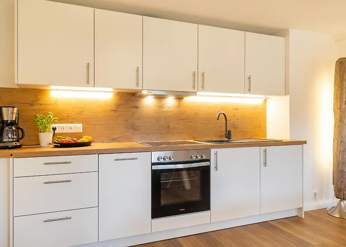 Iris Neu - Reetdachhaus Petersen Nebel